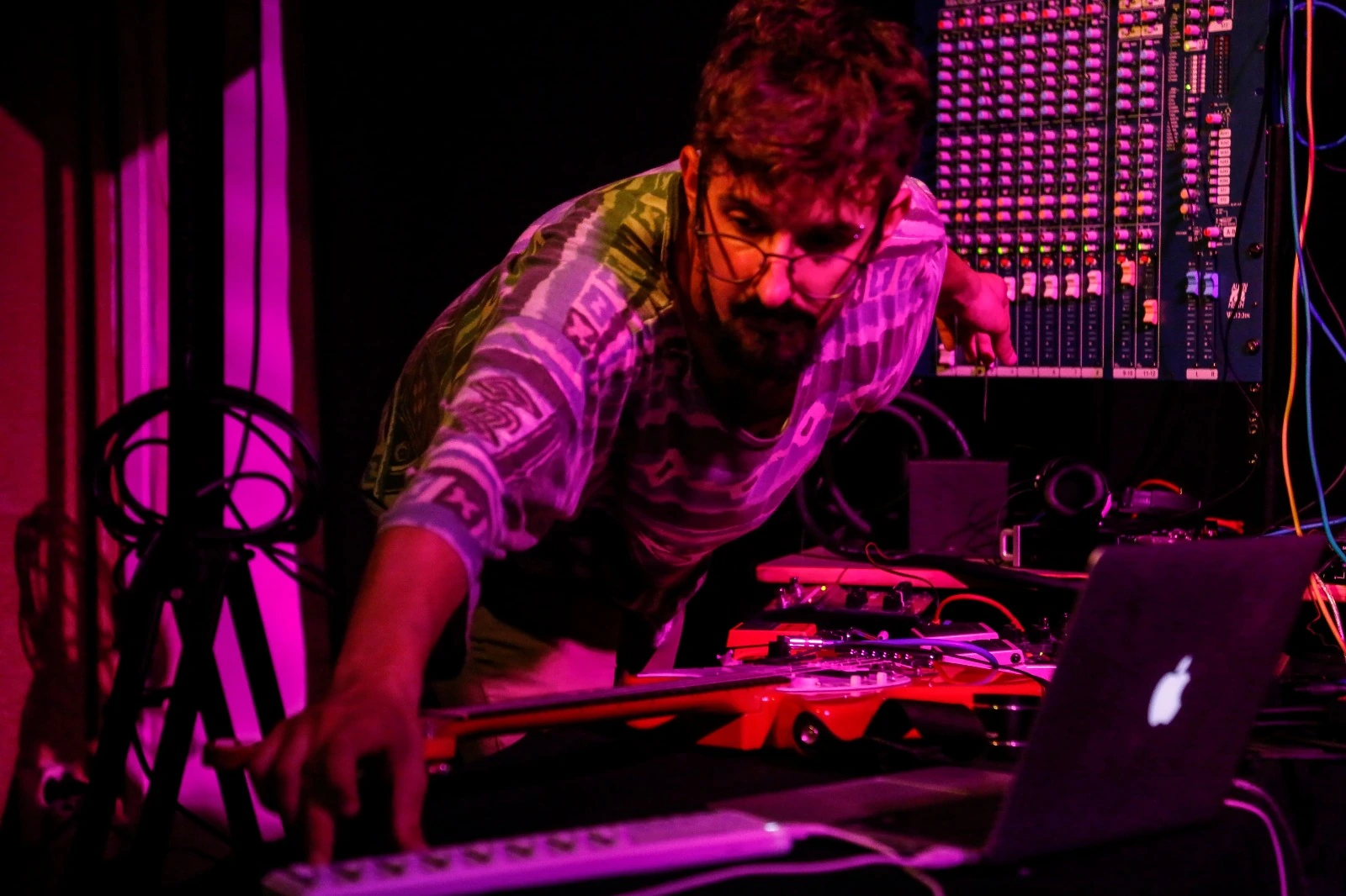 Lluis Surós performing with guitar, laptop, pedals, and mixing desk at LEM Festival in Barcelona